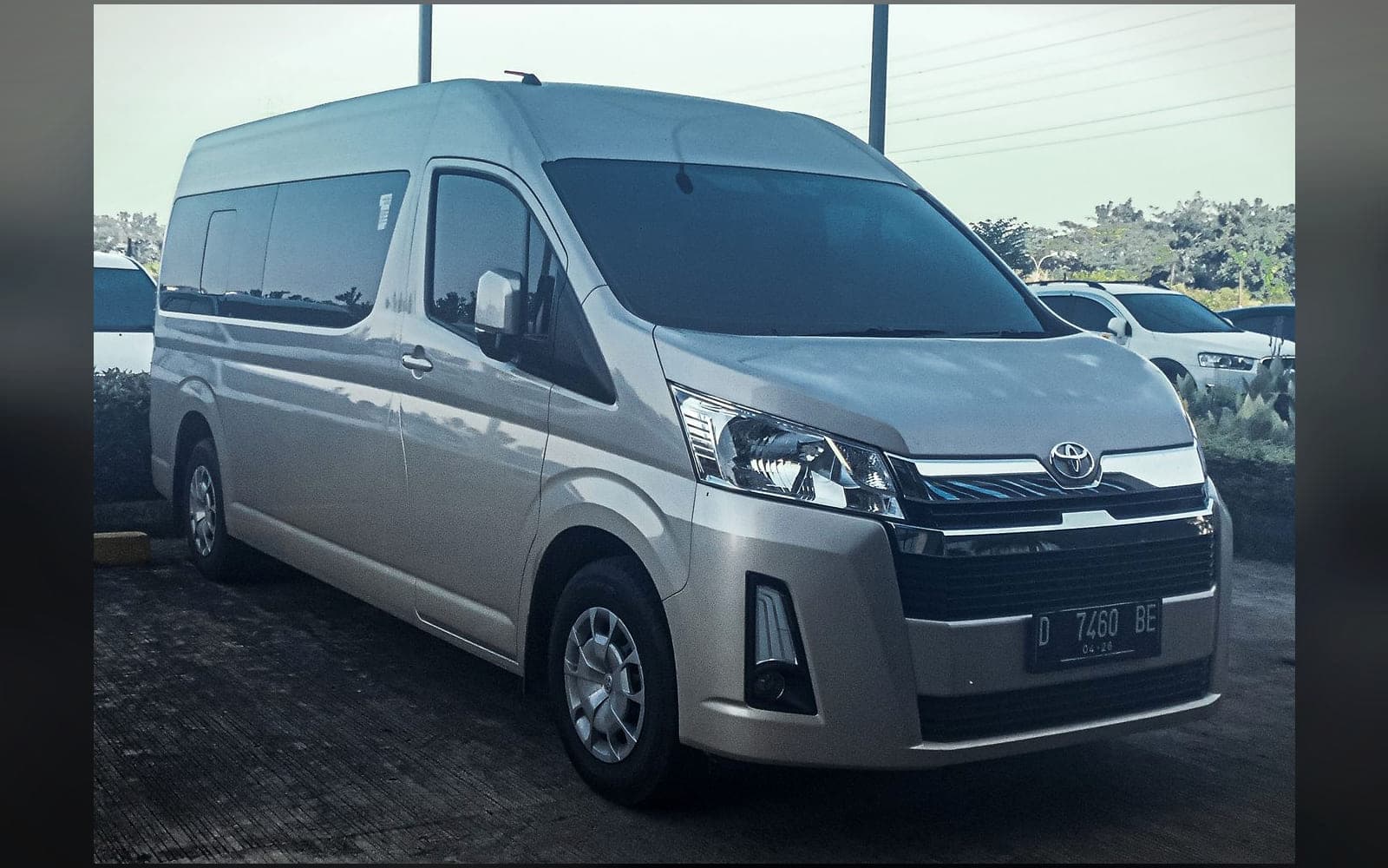 Silver Toyota Hiace eleven-seat microbus, front three-quarter view